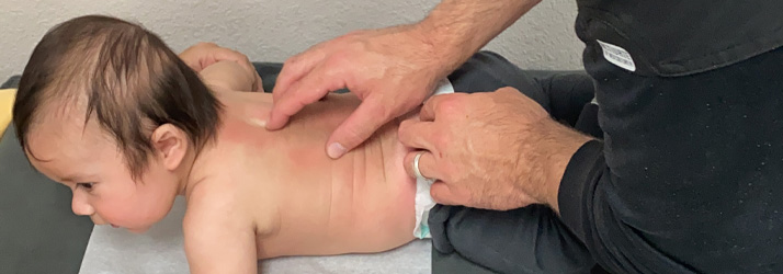 Chiropractor Heath TX David Waller Adjusting Child